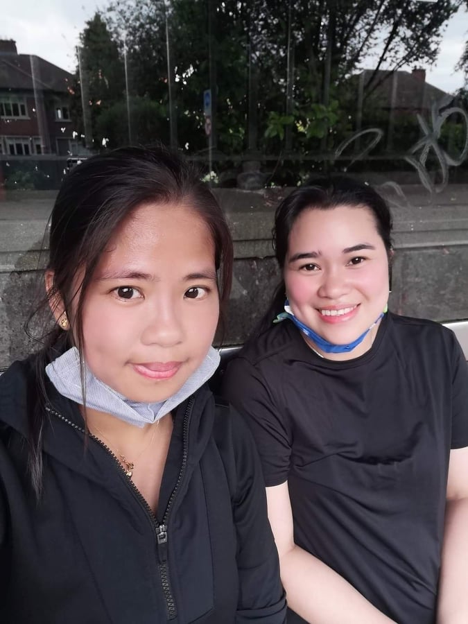 Two women in black tops smiling after completing their challenge